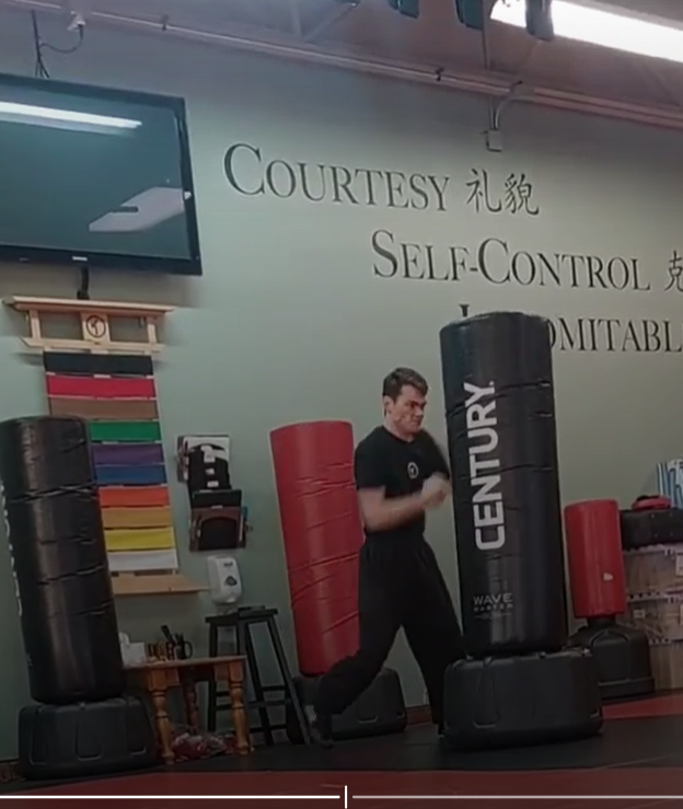 Teen instructor leading a class drill