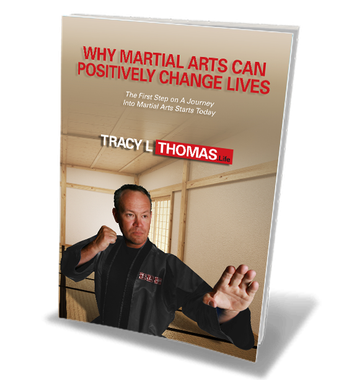Parent and child reviewing a martial arts guide