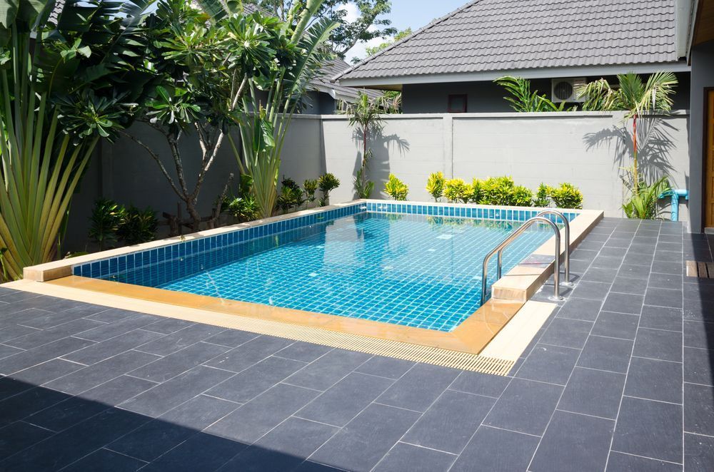 A Large Swimming Pool in the Backyard of a House —  Focus On Water In Cannonvale, QLD
