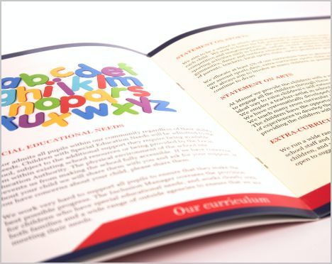 A book is open to a page with the alphabet on it