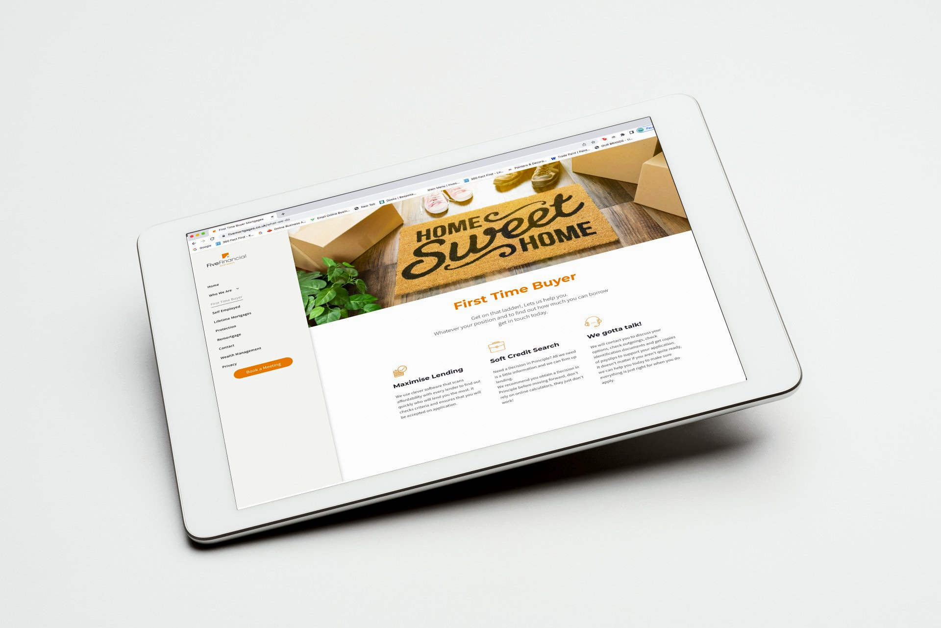 A tablet with a website on it is sitting on a table.