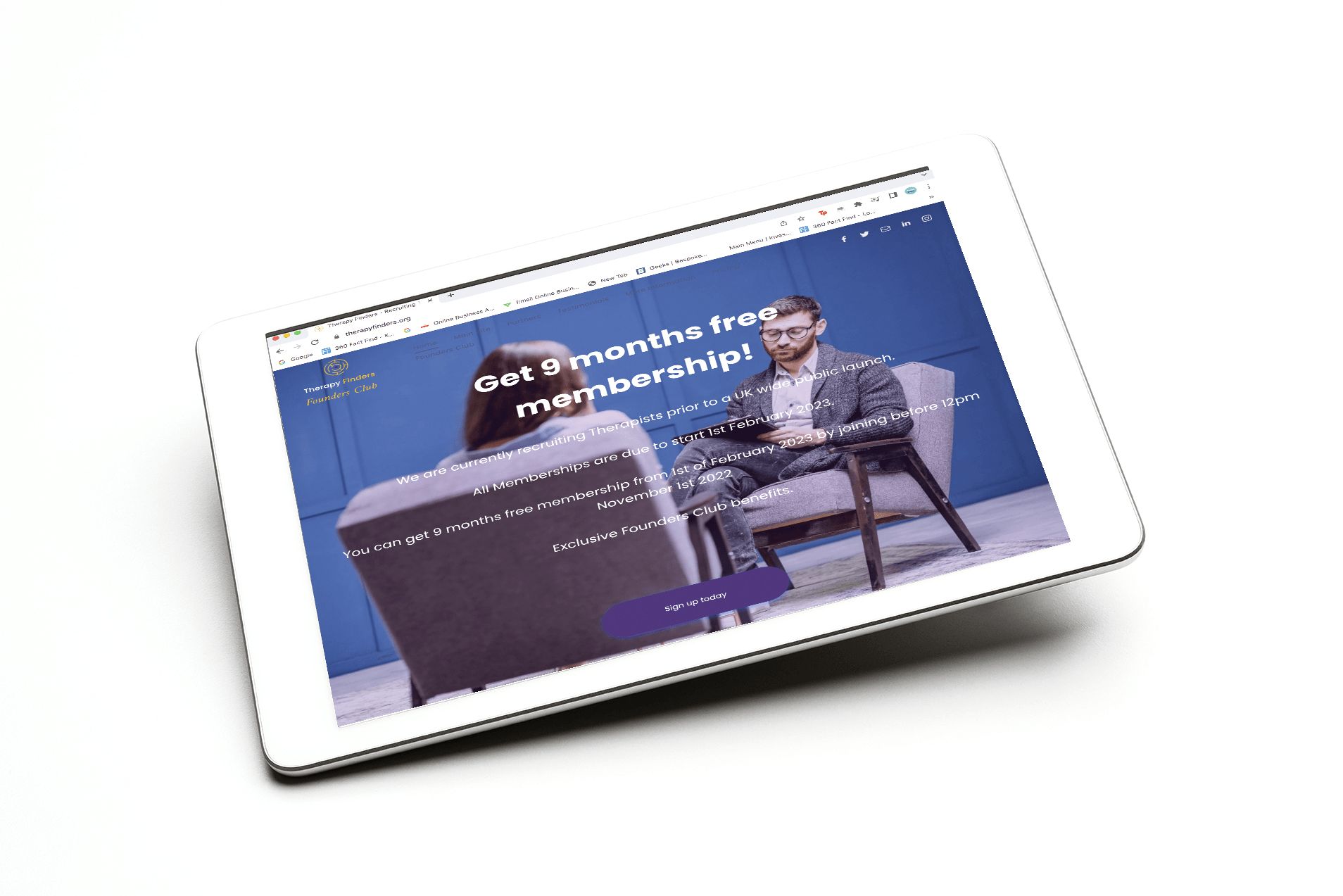 A tablet with a man sitting in a chair on the screen.