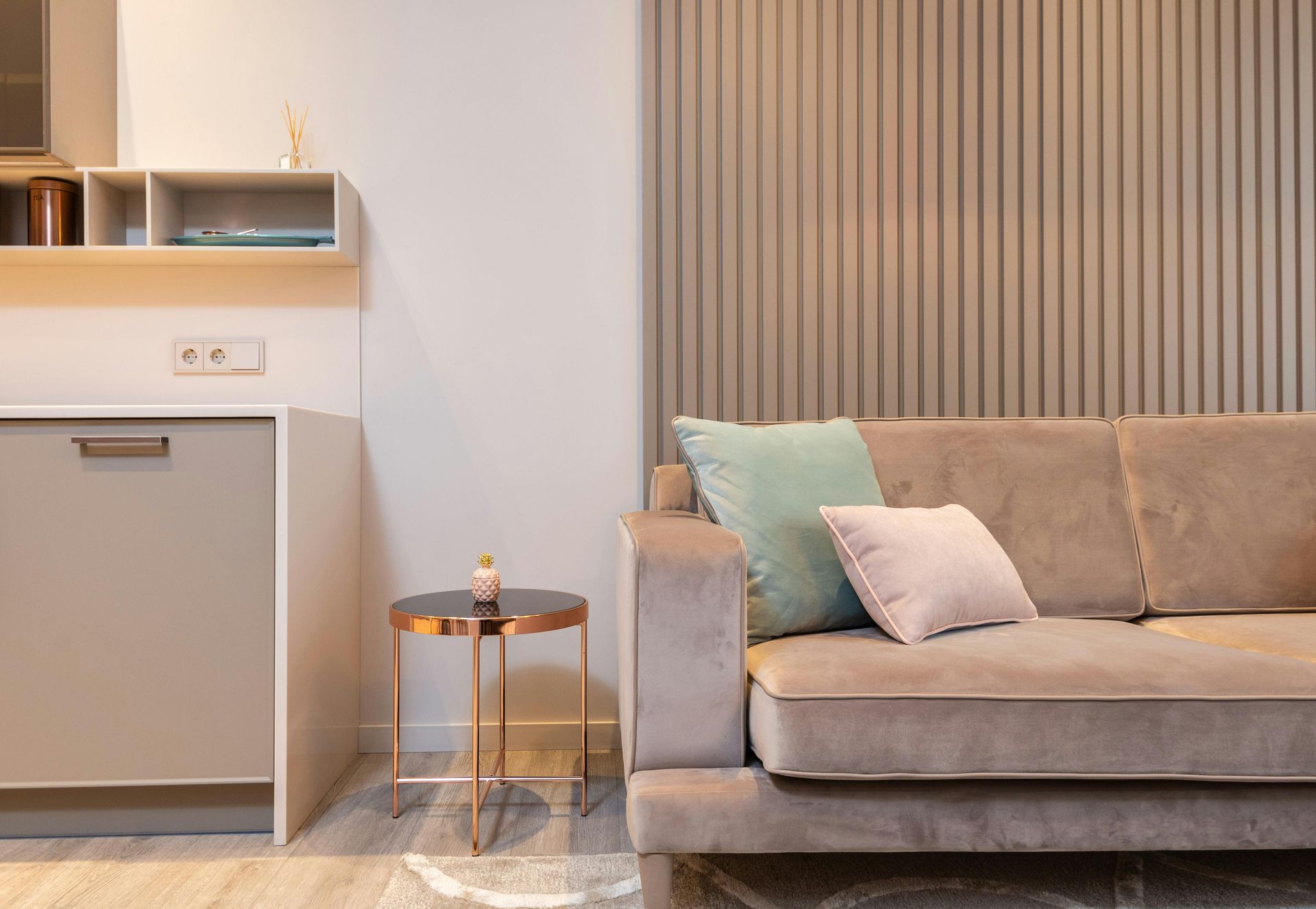 A living room with a couch and a small table.
