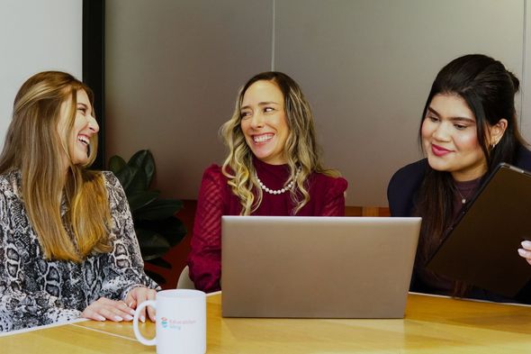 Fernanda Maia and the Way Group team at a table