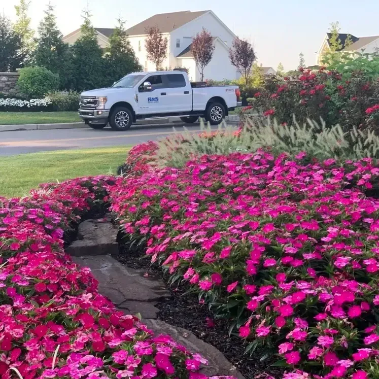 R&S truck with flower bed. Business professionals are hardscaping with team members. Do you have a commercial or industrial property in the Chester County area? R&S Property Services is the leading commercial landscaping company in Chester County, keeping properties looking their best all year round. Learn more about our landscaping services here.