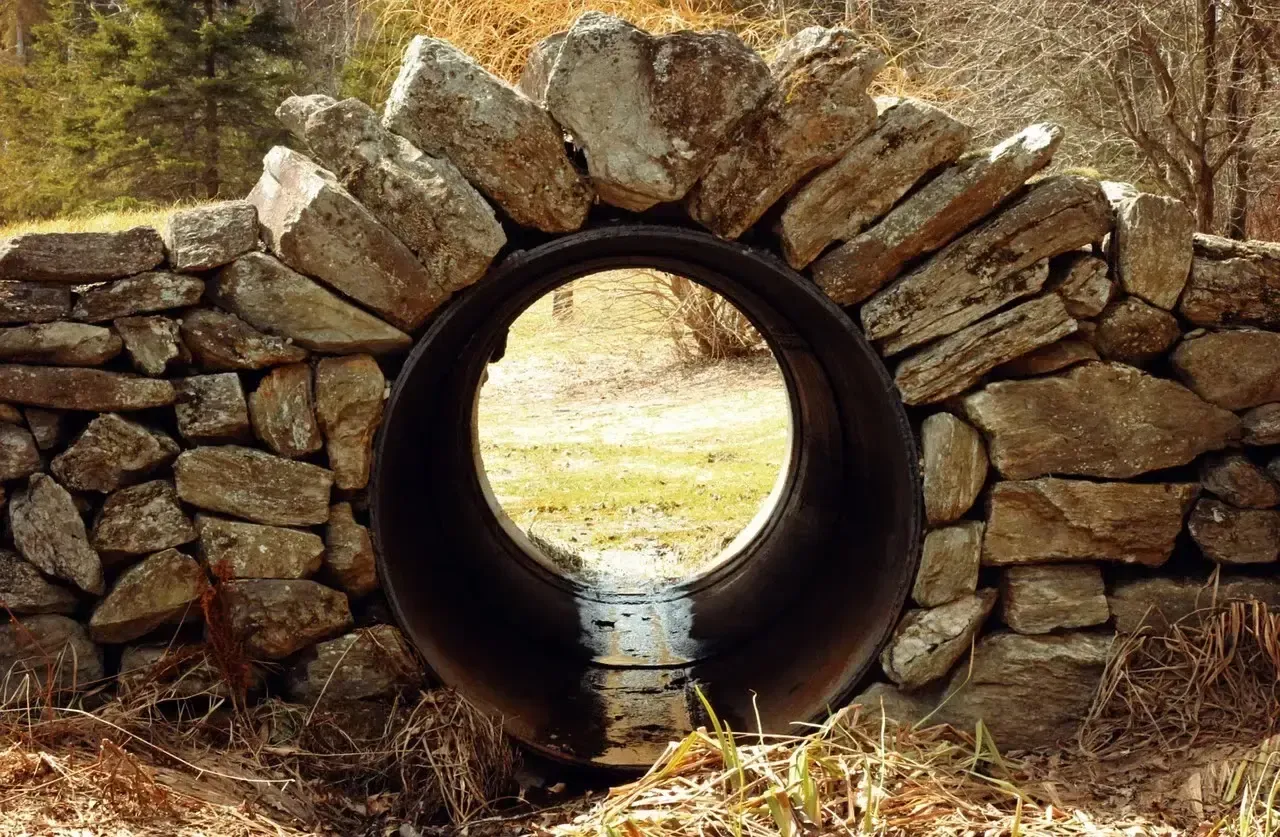 A drainage pipe built into an attractive hardscape feature on a Chester County property