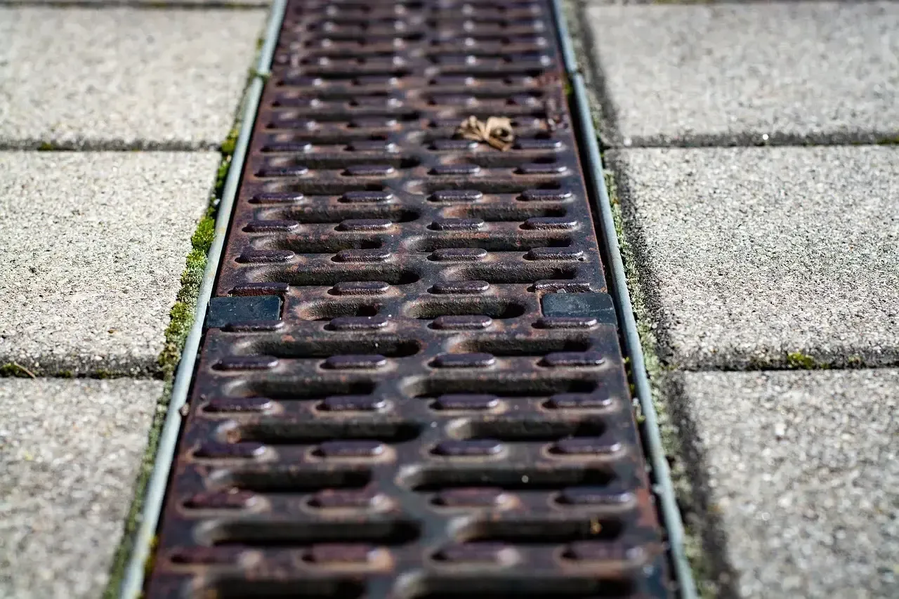 a box drain installed on the edge of a Chester County walkway