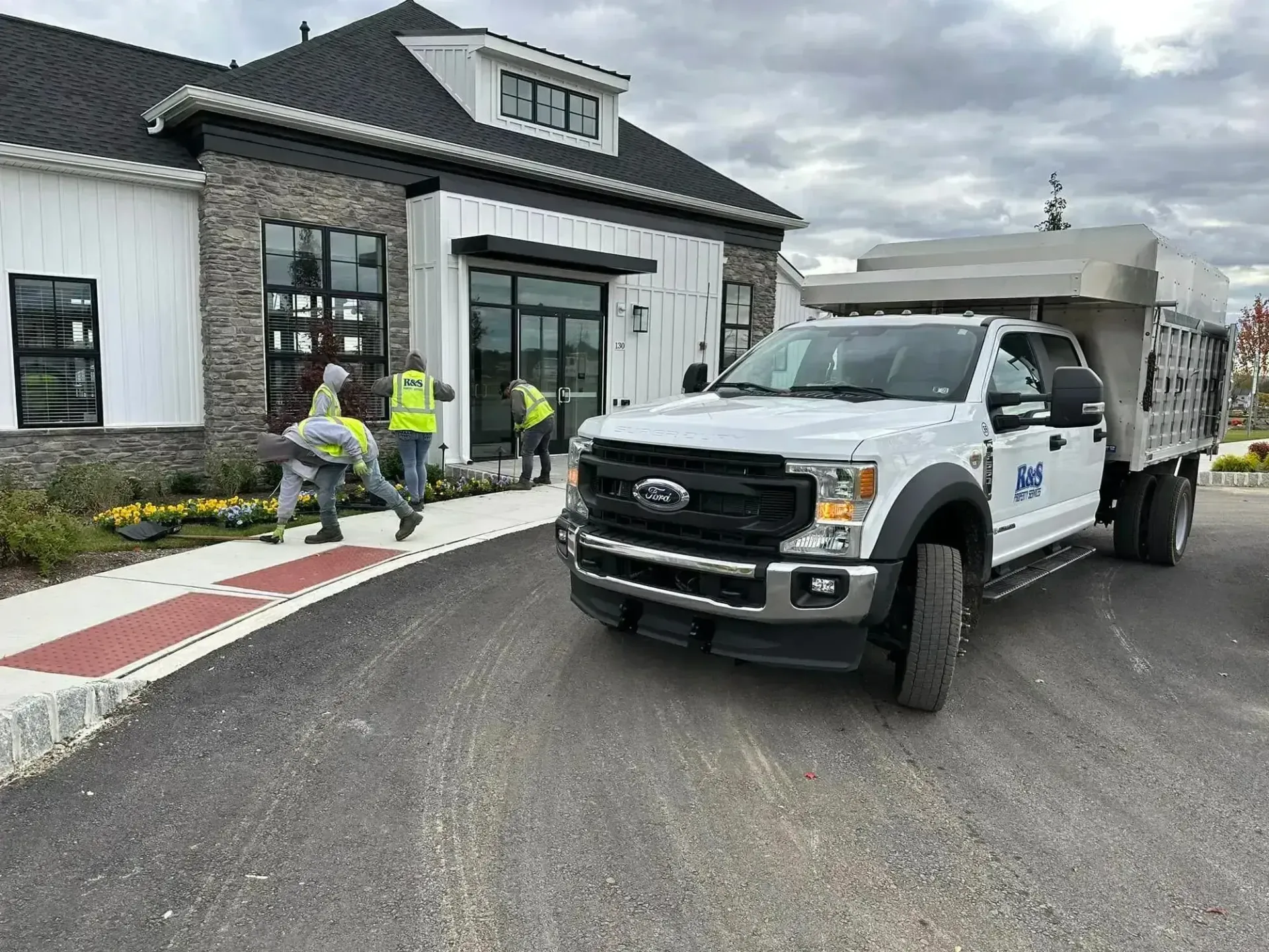 R&S Property Services team and truck outside of a Chester County property