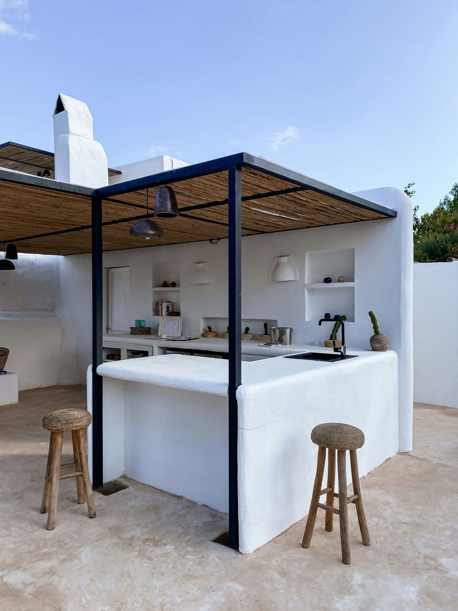 An attractive white outdoor kitchen
