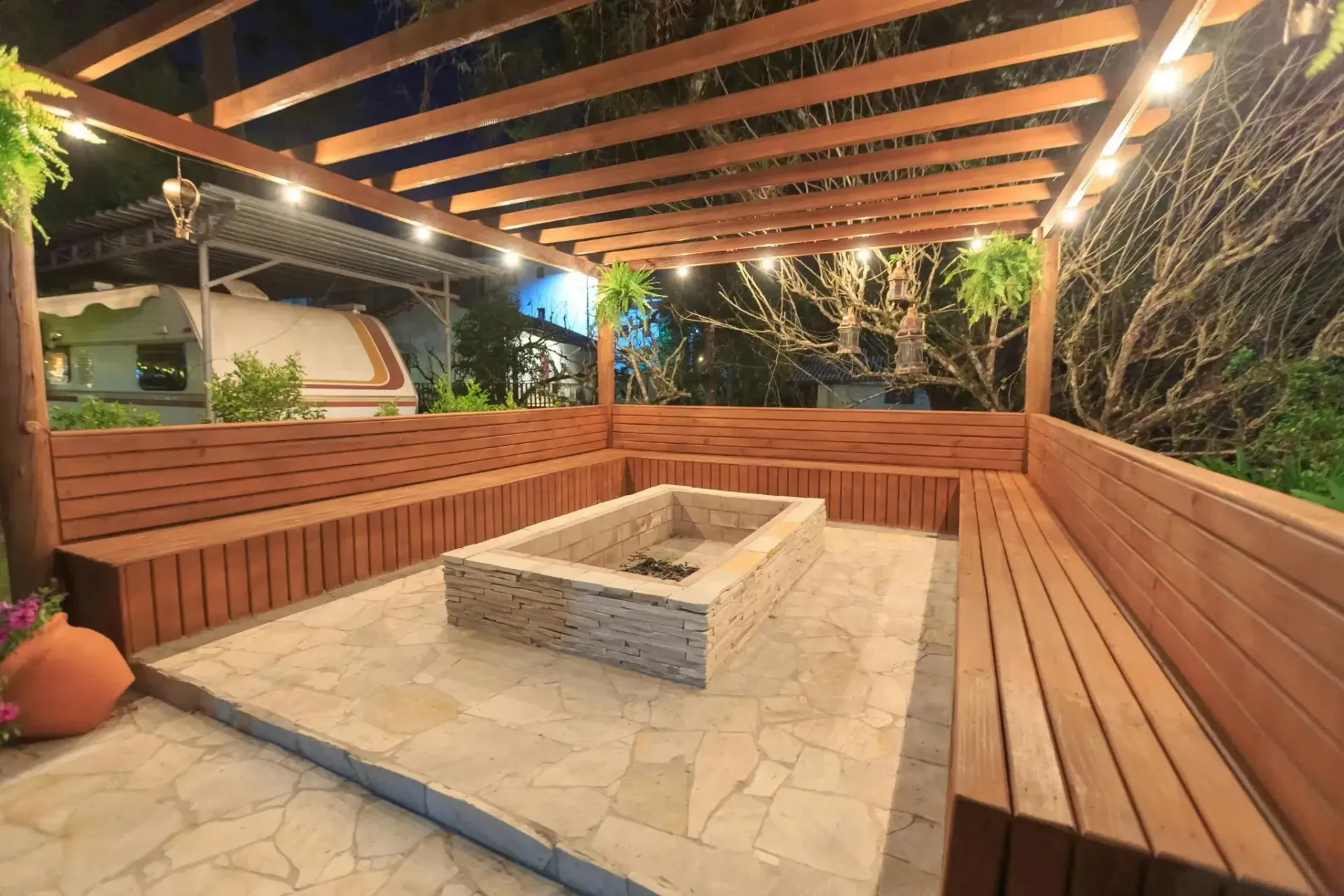 A West Chester, PA fire pit surrounded by a wooden seating area