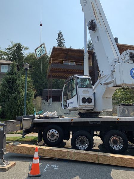 Crane lifting window in air