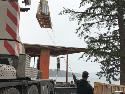 Craning windows into house being built