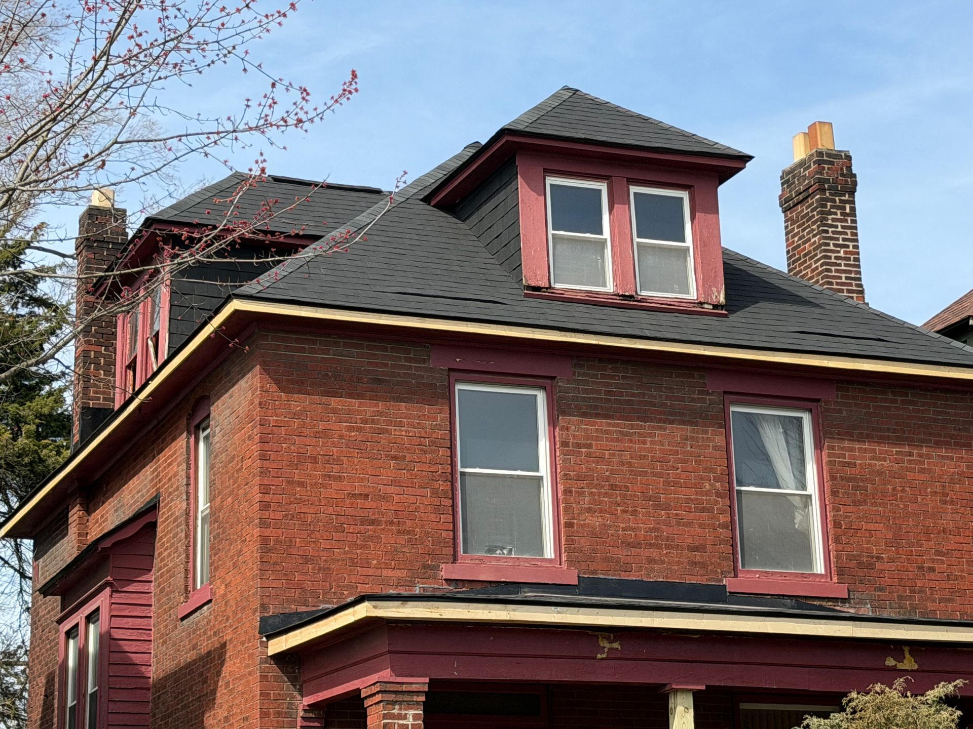 'Brick cottage with a new roof in German Village, Columbus'; 'New
seamless gutters on a historic German
Village home'