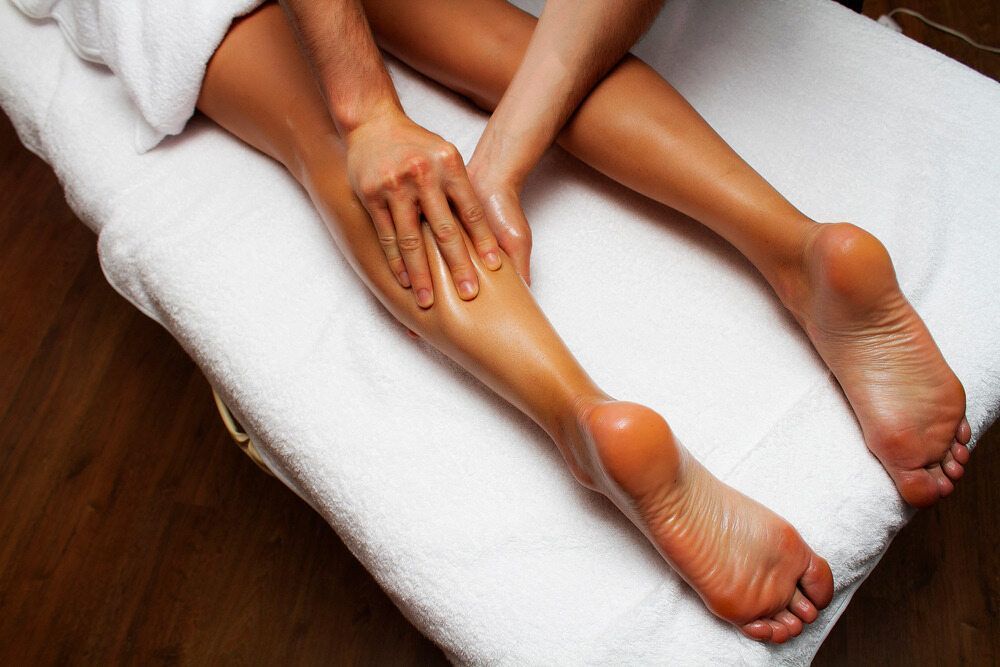 A Woman Is Getting A Massage On Her Leg — Phoenix Mandorla In Rockhampton City, QLD