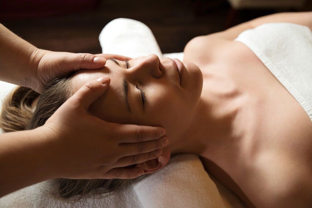 A Woman Is Getting A Head Massage At A Spa — Phoenix Mandorla In Rockhampton City, QLD