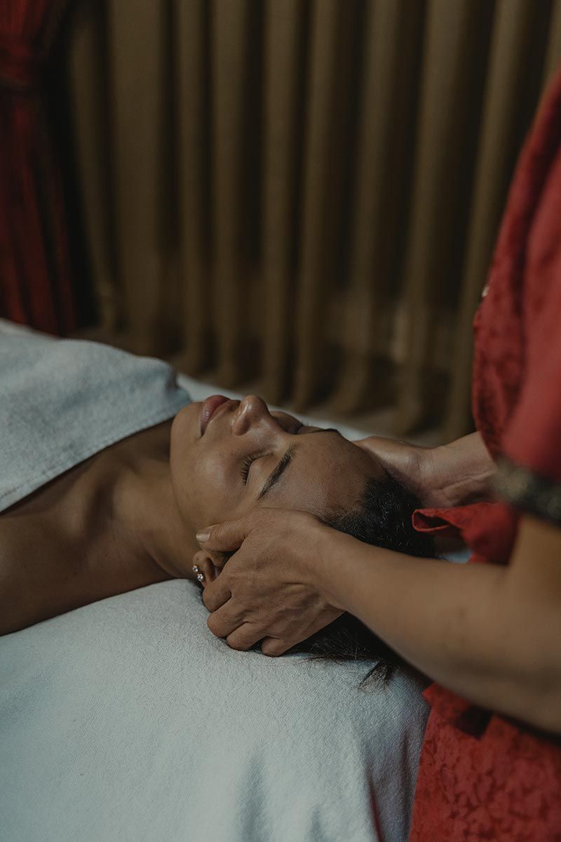 A Woman Is Getting A Head Massage At A Spa — Phoenix Mandorla In Rockhampton City, QLD