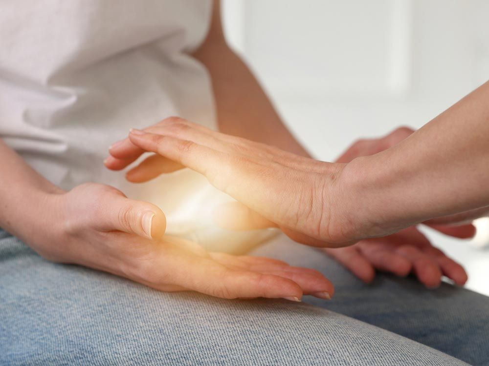 A Person Is Holding A Light In Their Hands — Phoenix Mandorla In Rockhampton City, QLD
