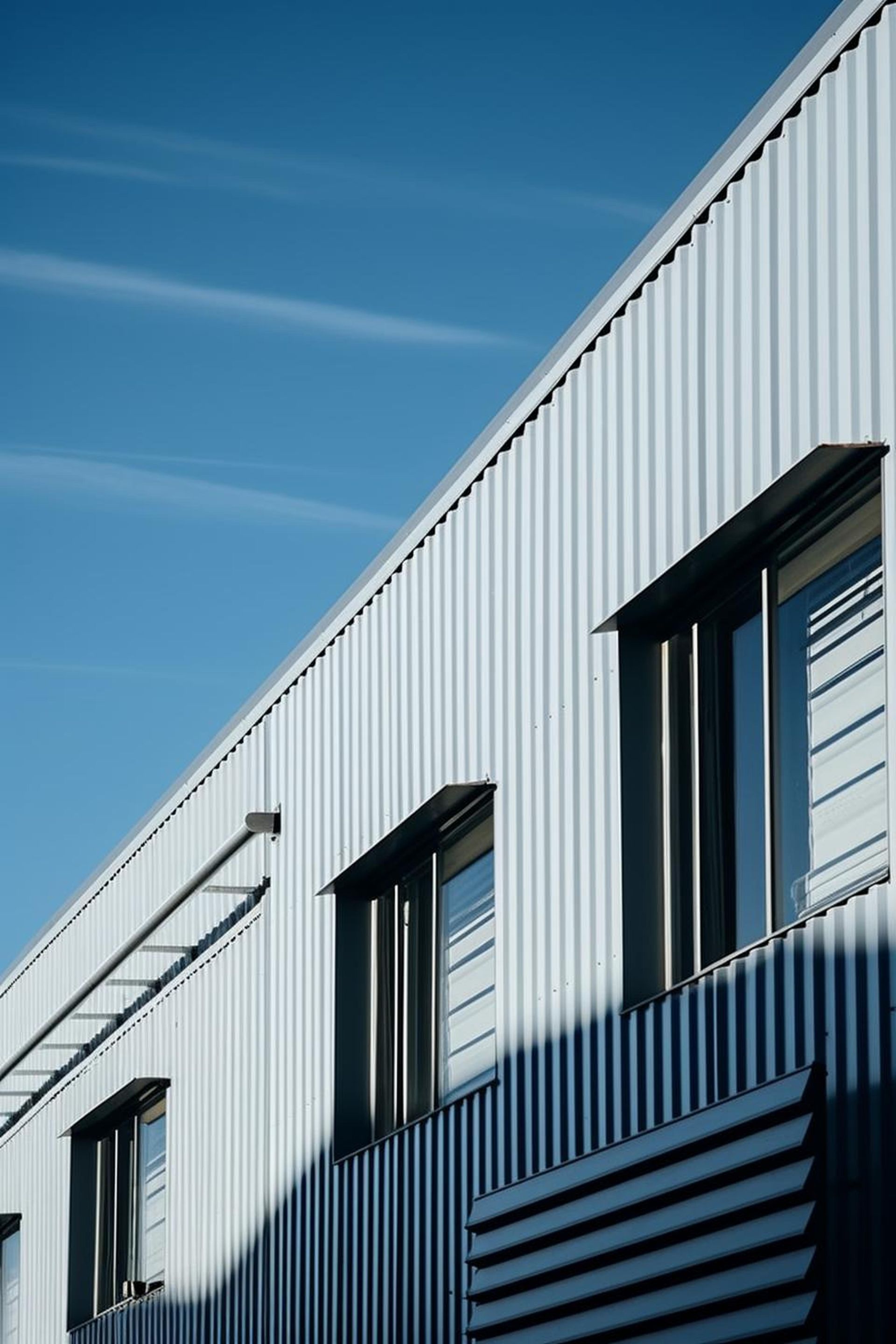 A close up of a building with a blue sky in the background.