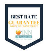 A badge that says `` best rate guarantee when you book first ''.