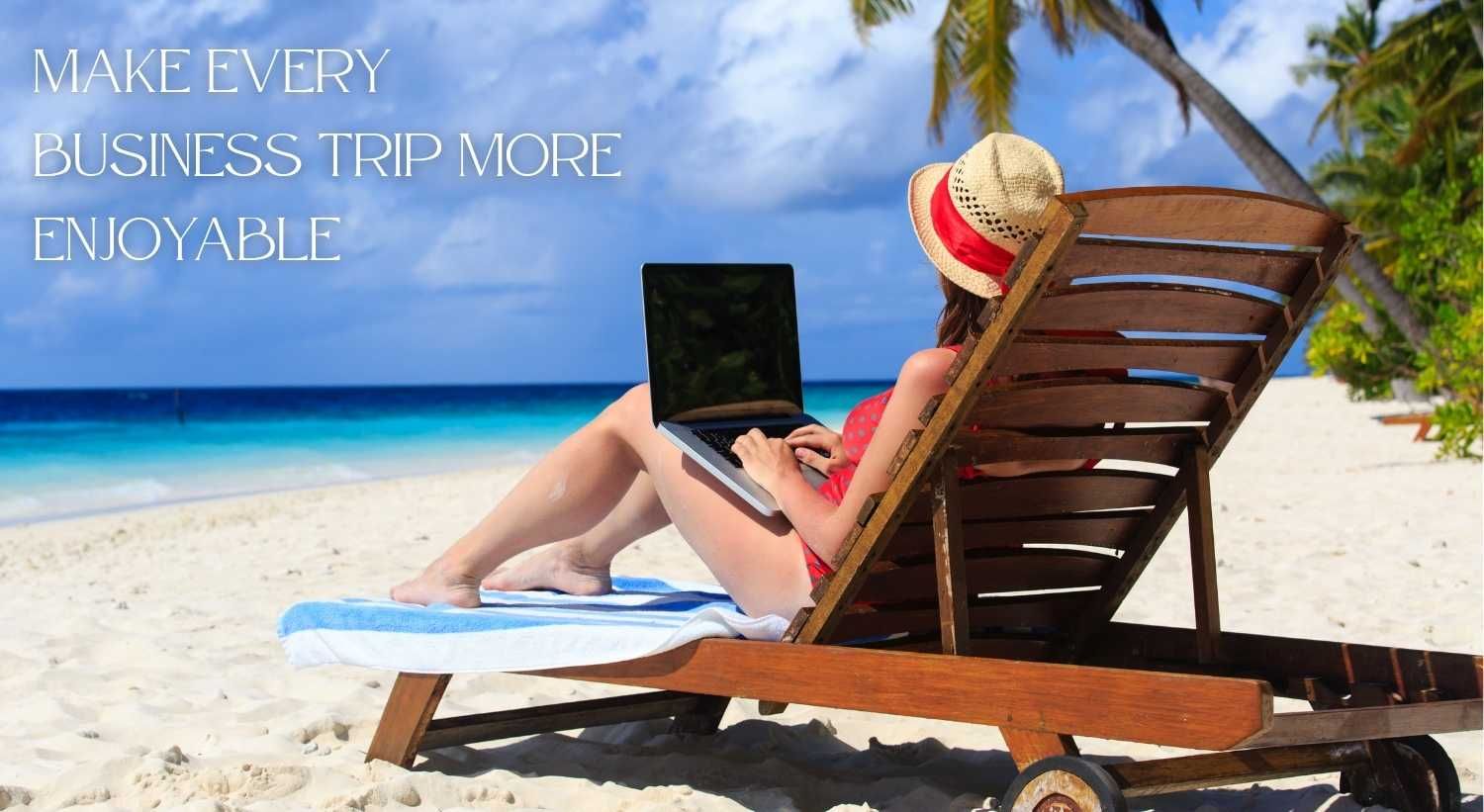 A woman working on a laptop on the beach during a relaxing business trip.