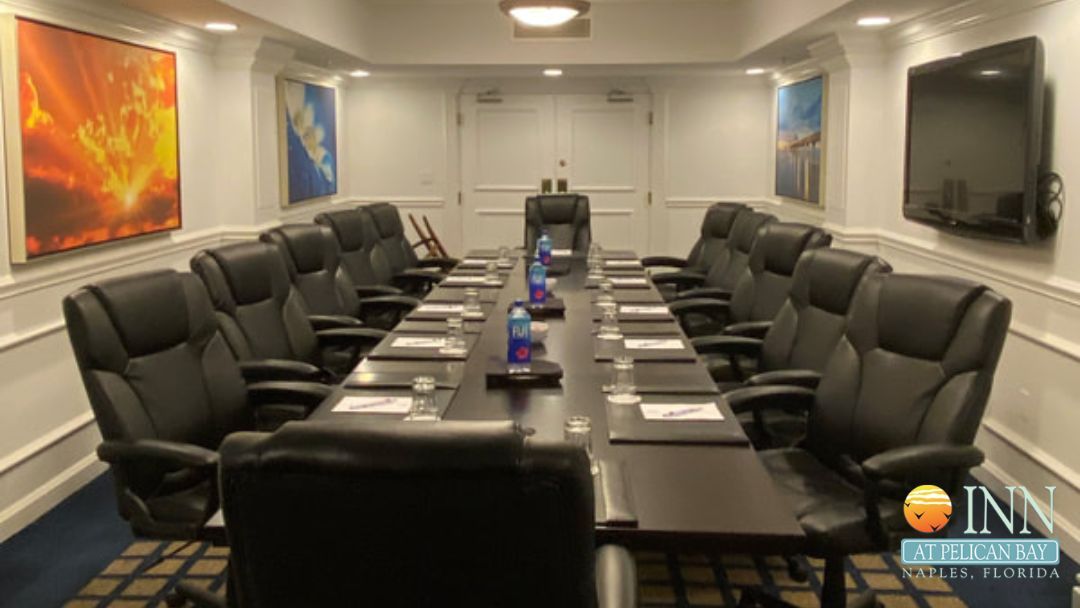 A conference room with a long table and chairs