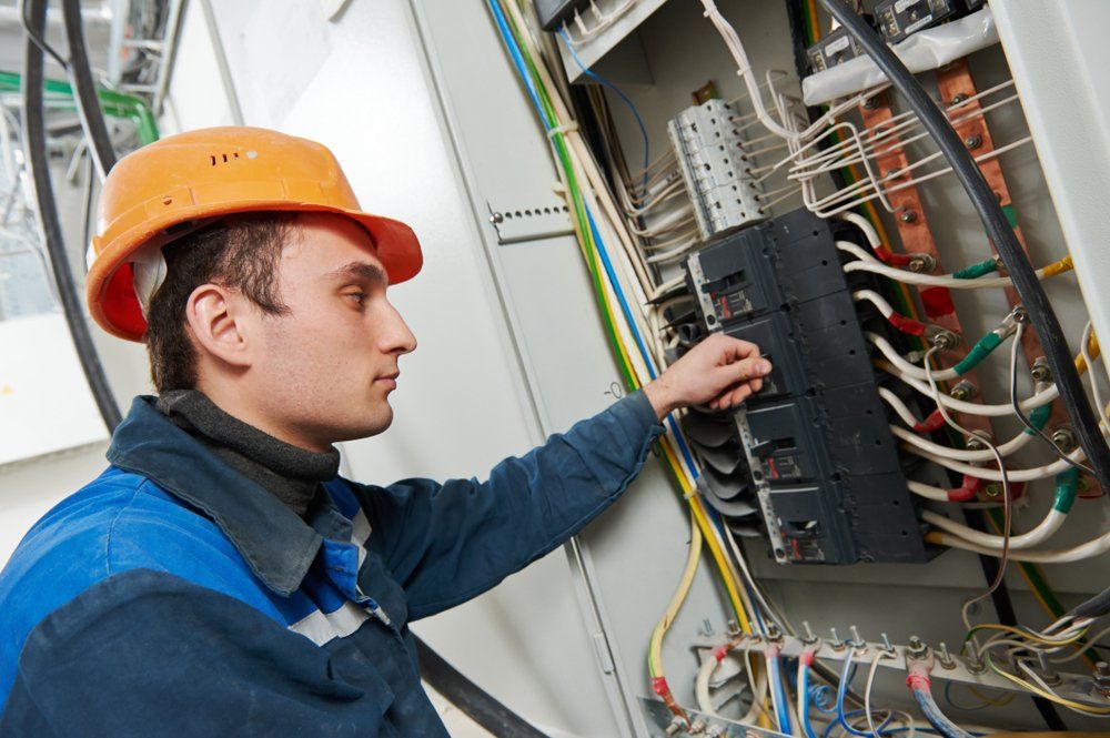 Electrician Working — Commercial Electrician in Gympie, QLD