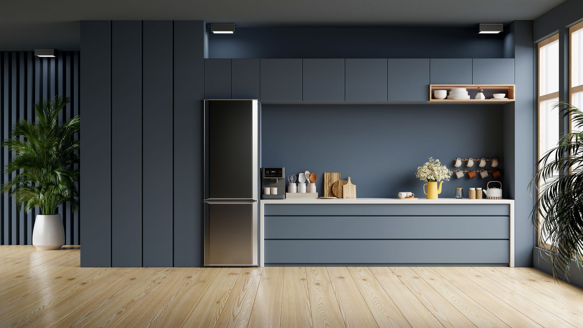 A modern kitchen glass splashback with blue cabinets and a stainless steel refrigerator.