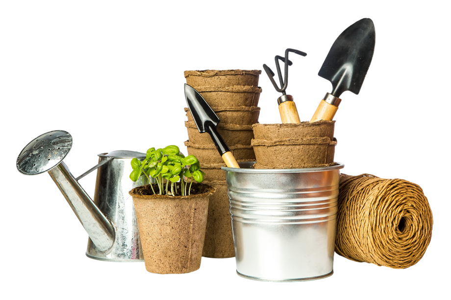Gardening tools and burlap pots arranged with a metal watering can and seedling in a small pot