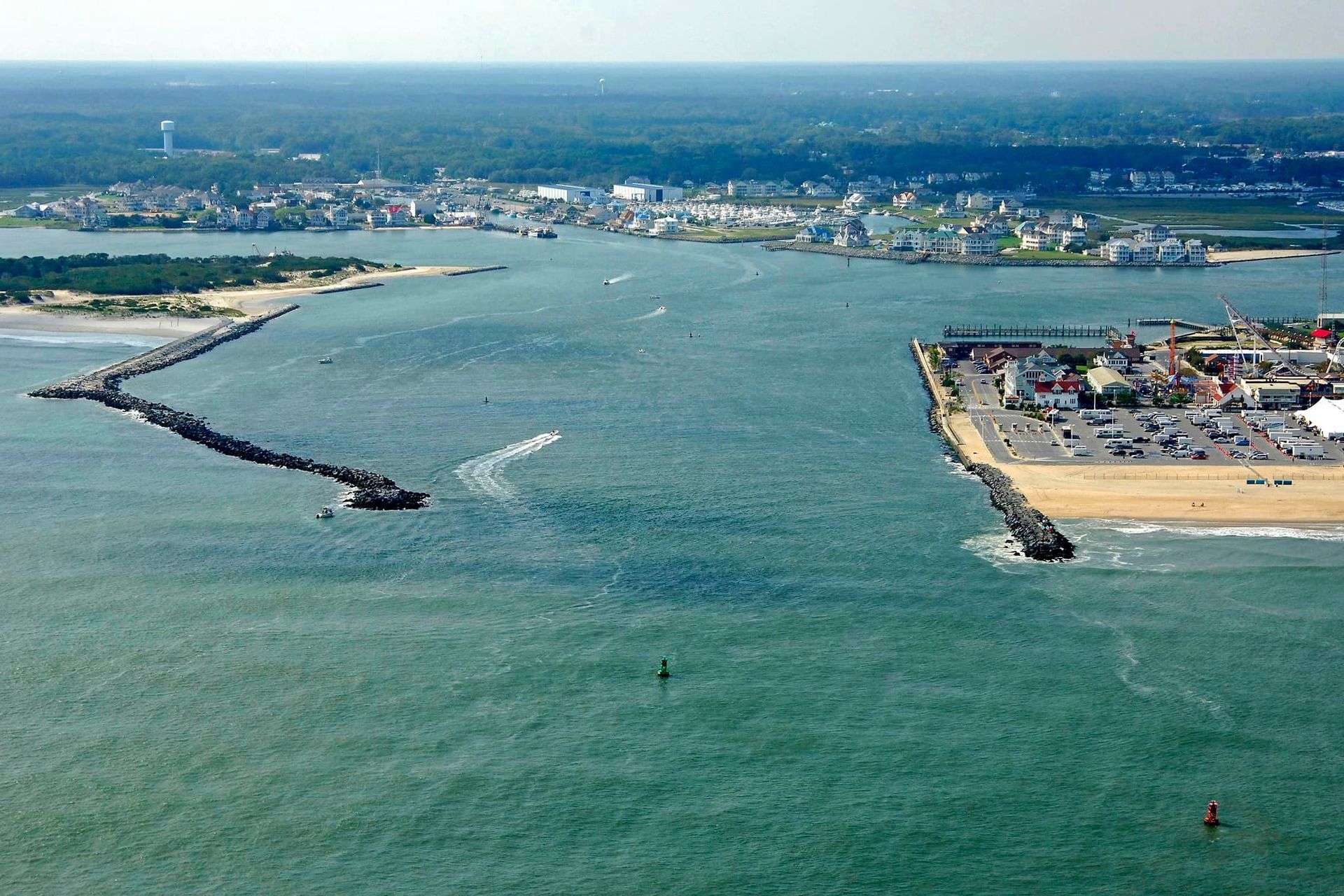 An aerial view of a body of water with a city in the background