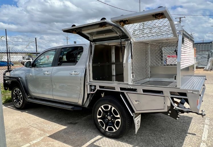 A Silver Truck With A Canopy On Top Of It Is Parked In A Parking Lot — Ward's Aluminium in Garbutt, QLD