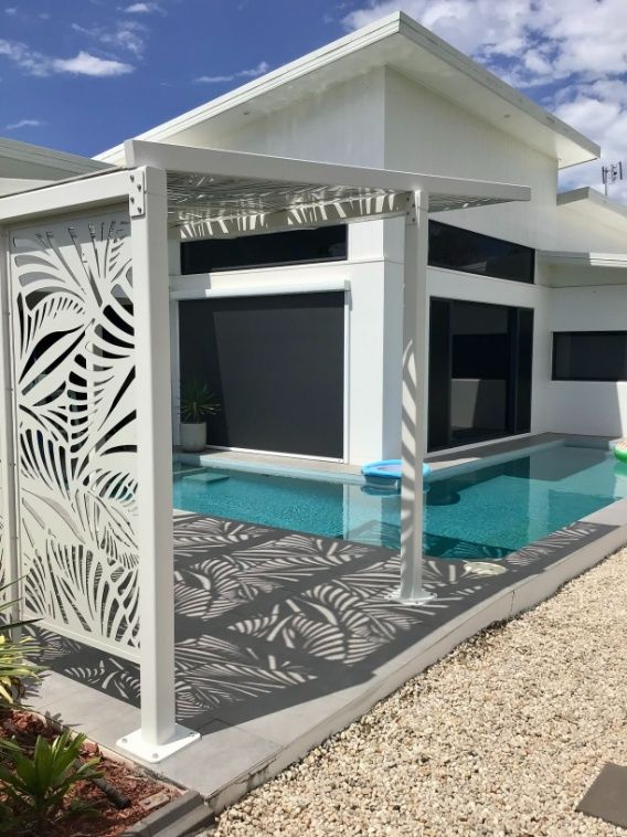 A White House With A Swimming Pool In Front Of It — Ward's Aluminium in Garbutt, QLD
