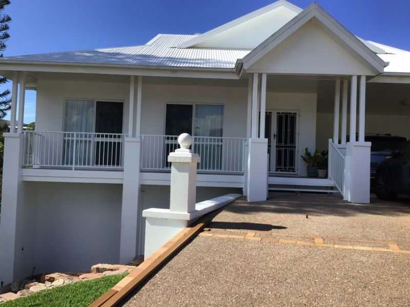 A White House With A Car Parked In Front Of It — Ward's Aluminium in Burdekin, QLD