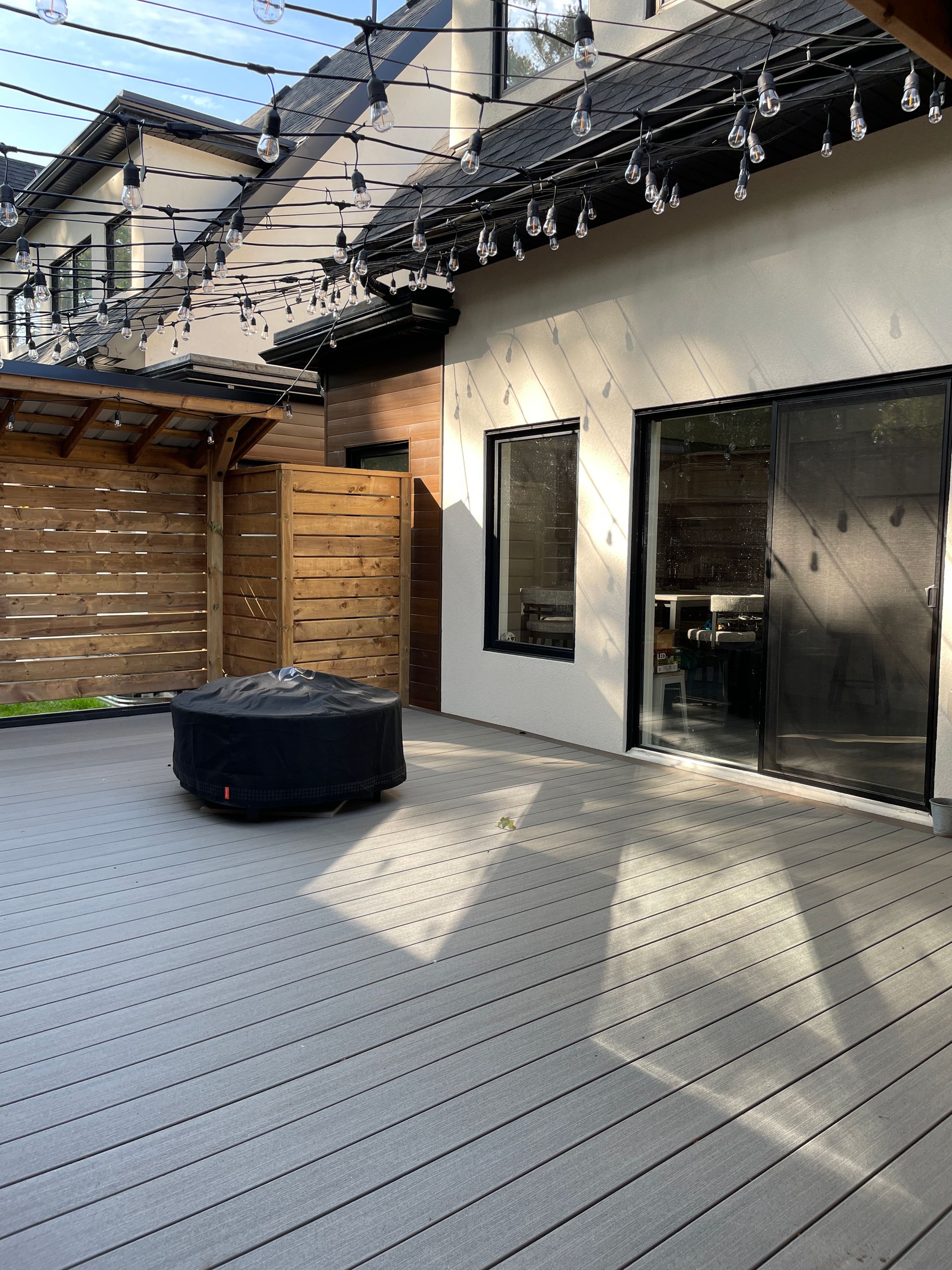 composite backyard deck with fireplace