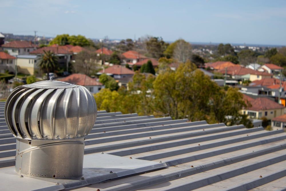 A Roof with A Wind Turbine on Top of It — Danzair Refrigeration & Airconditioning in South Lismore, NSW