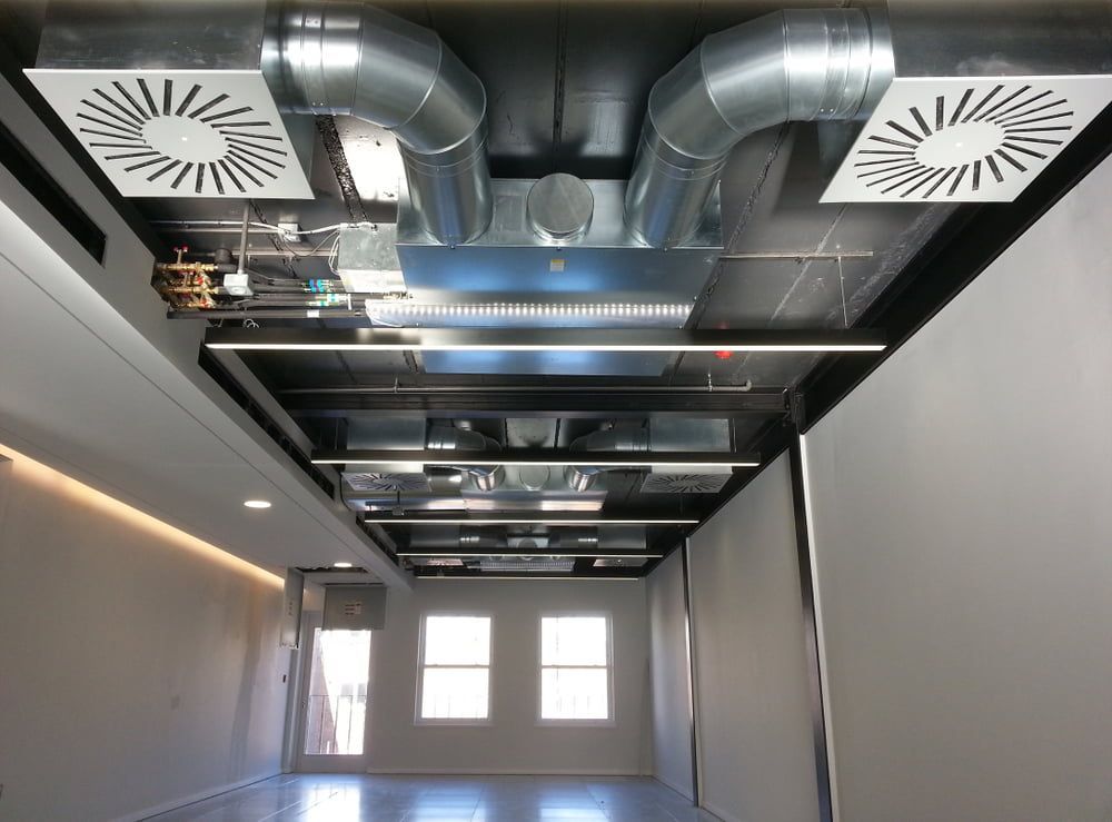 A Room with A Lot of Pipes Hanging from The Ceiling — Danzair Refrigeration & Airconditioning in South Lismore, NSW