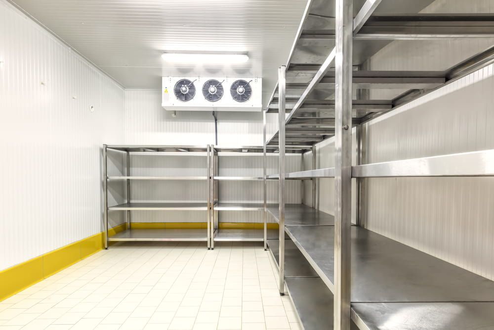 A Room with Stainless Steel Shelves and A Refrigerator — Danzair Refrigeration & Airconditioning in South Lismore, NSW