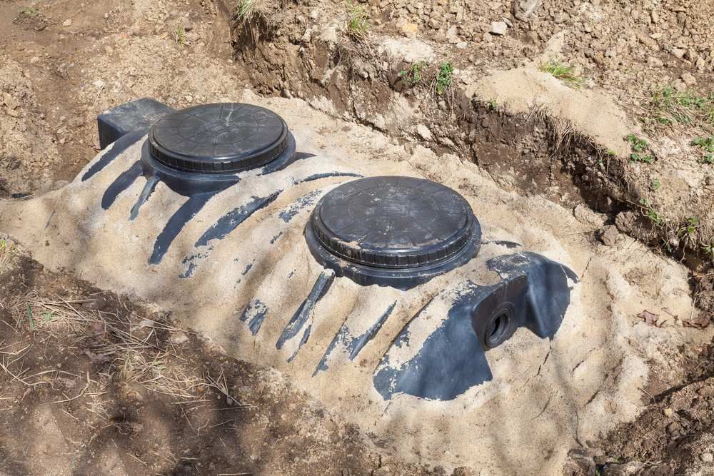A Septic Tank is Sitting in the Middle of a Dirt Field — Treatwater & Plumbing Pty Ltd in North Mackay, QLD