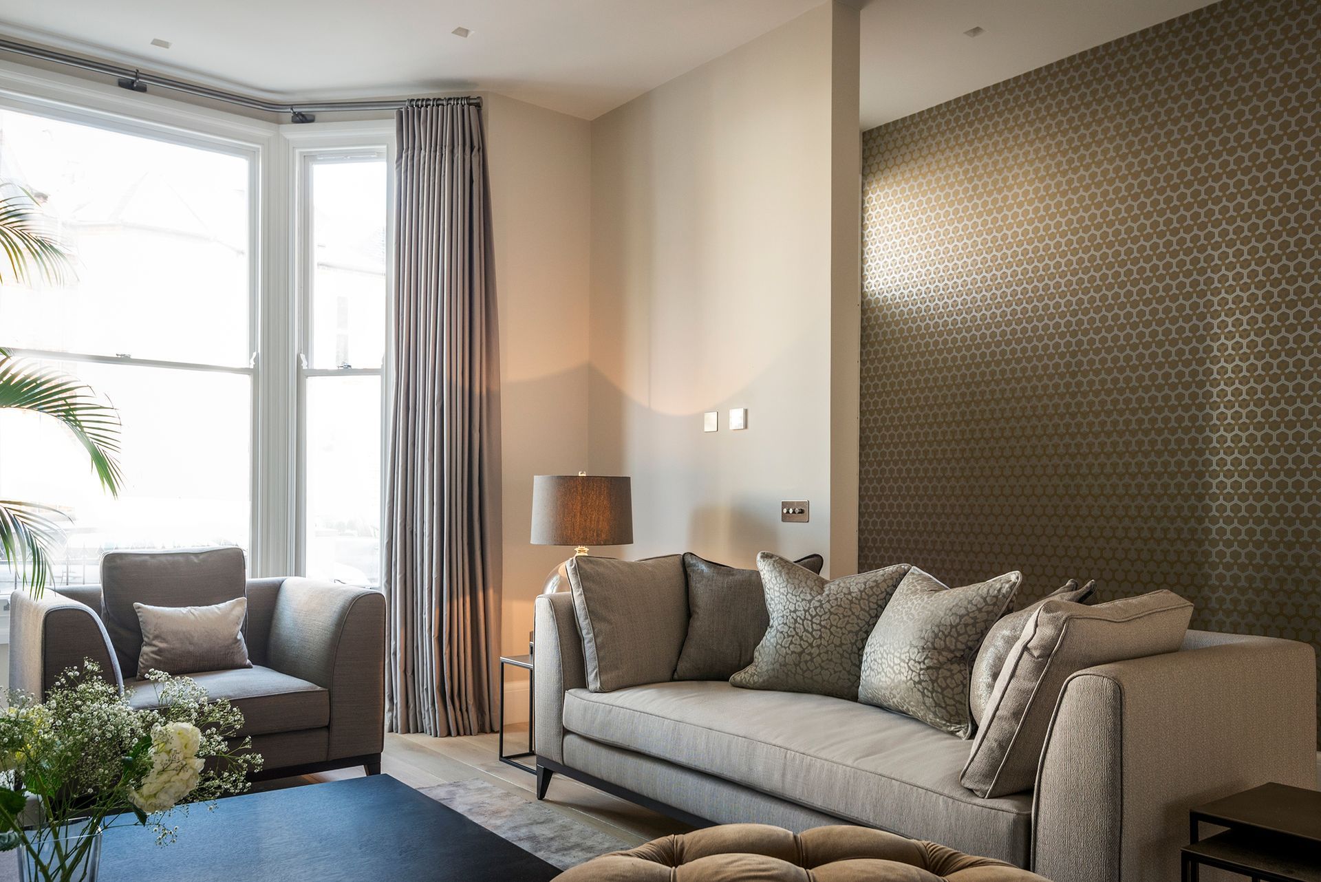 a living room with a couch , chair and coffee table