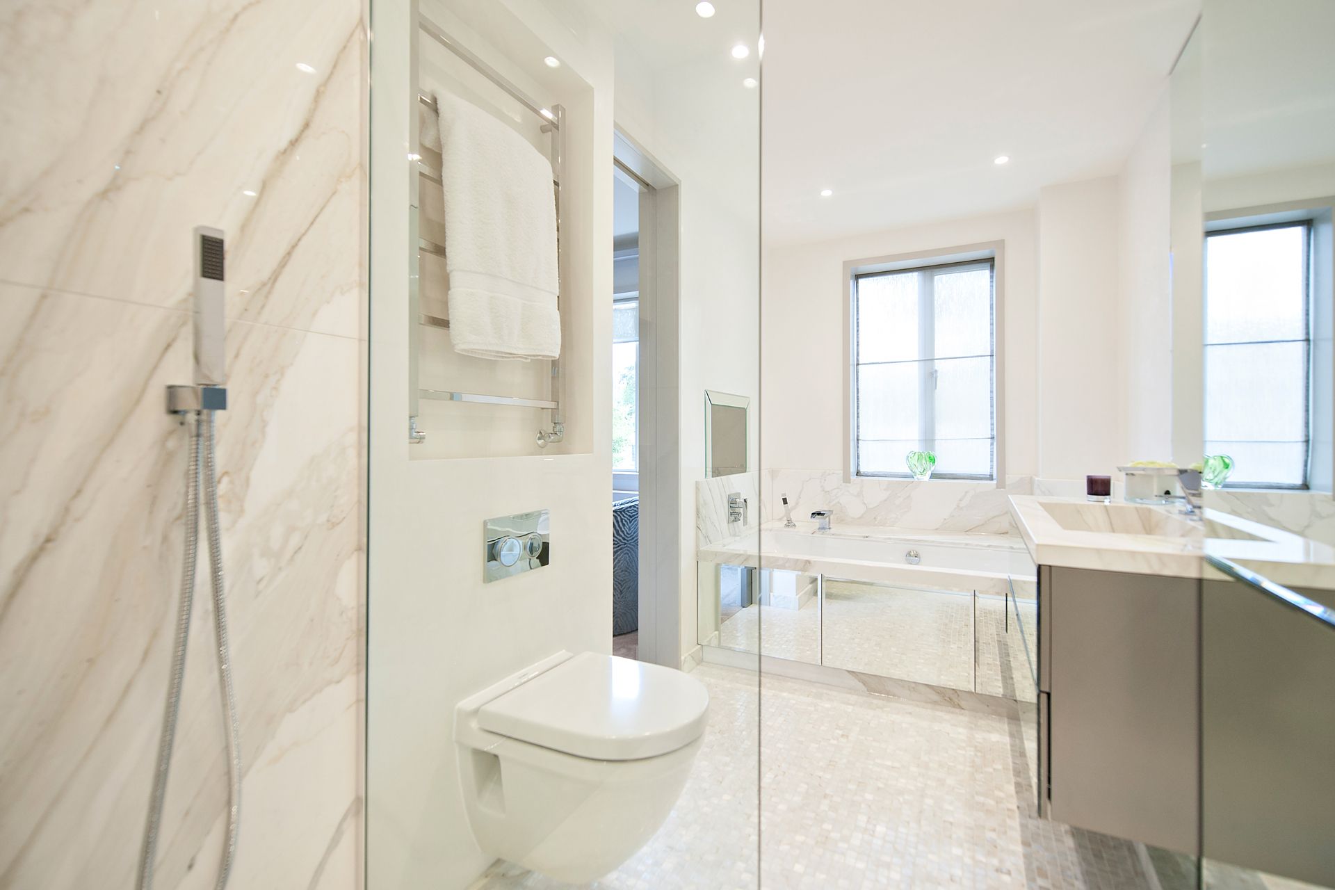 a bathroom with a toilet , sink , and shower 