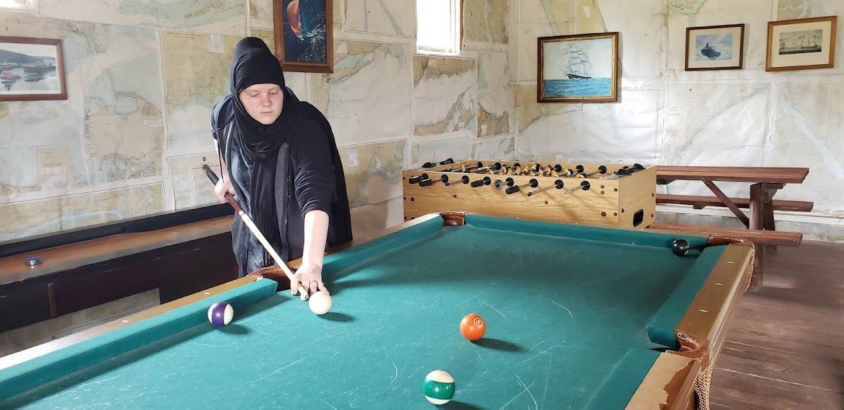 guest playing pool