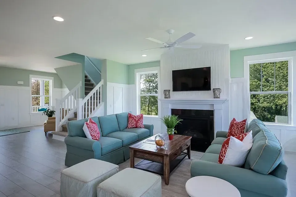 A living room filled with furniture and a fireplace.