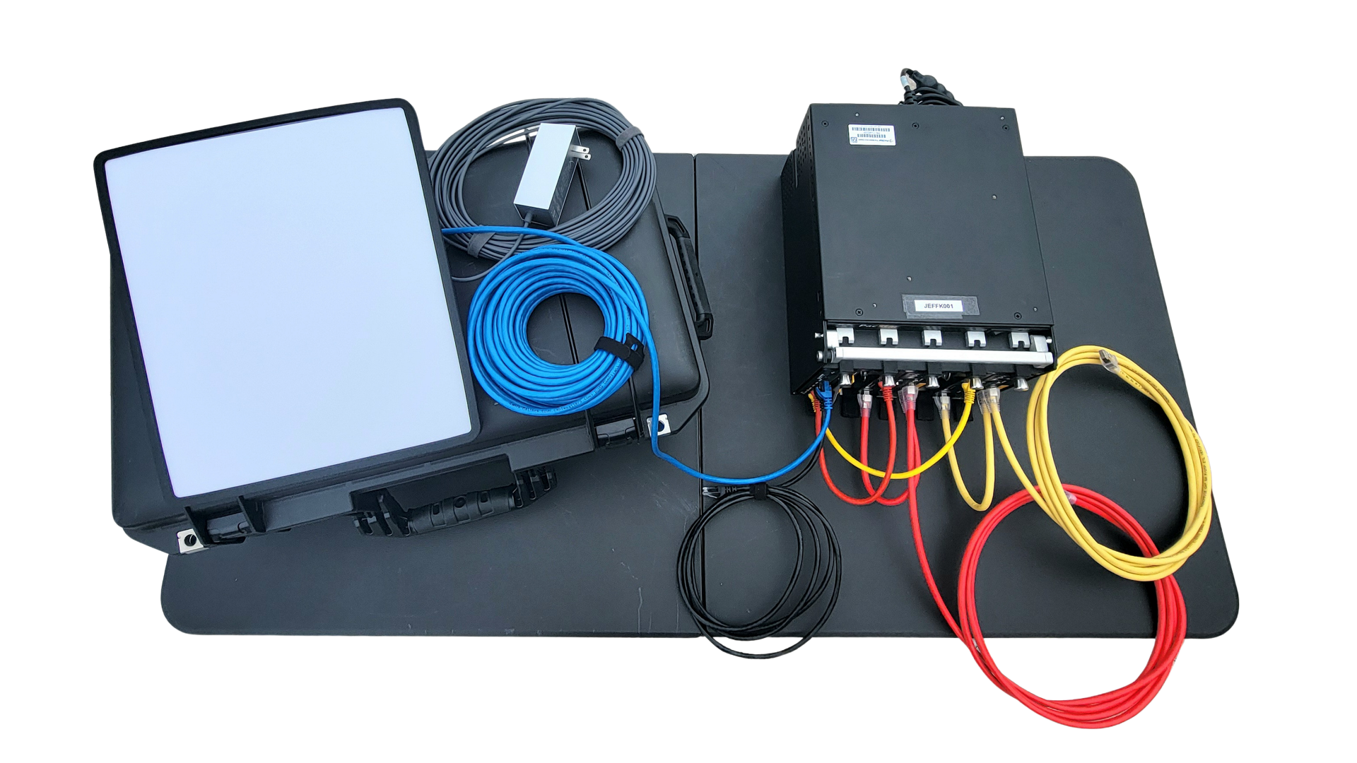 JEFF-K kit components — Starshield SATCOM terminal, Pelican case, cabling, and PacStar compute appliance.
