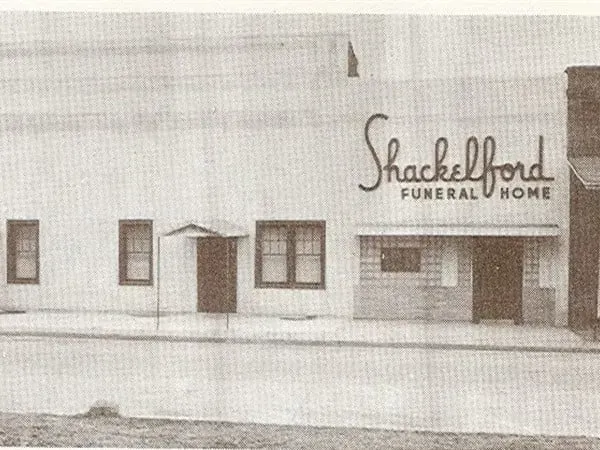 Shackelford Funeral Home storefront with a white facade and small windows