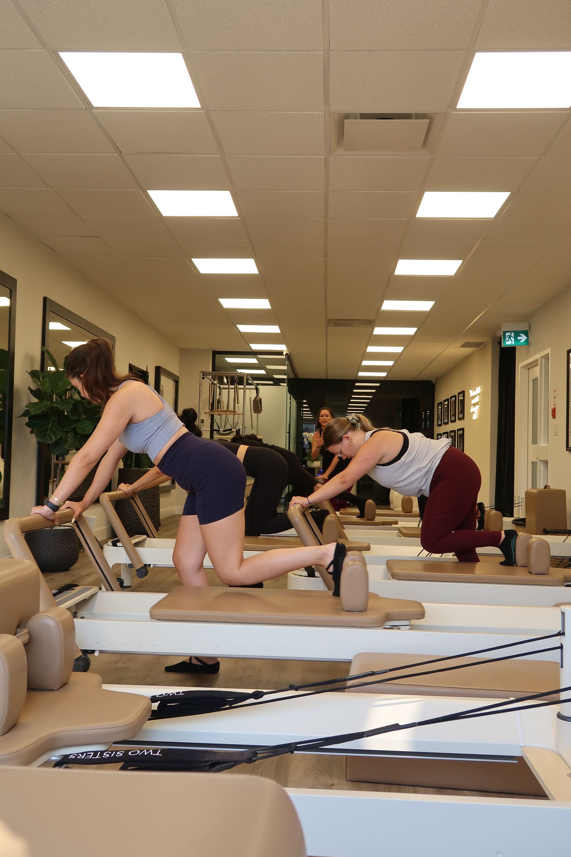 Small group Reformer Pilates class in Oakville at Two Sisters Pilates focusing on strength and mobility