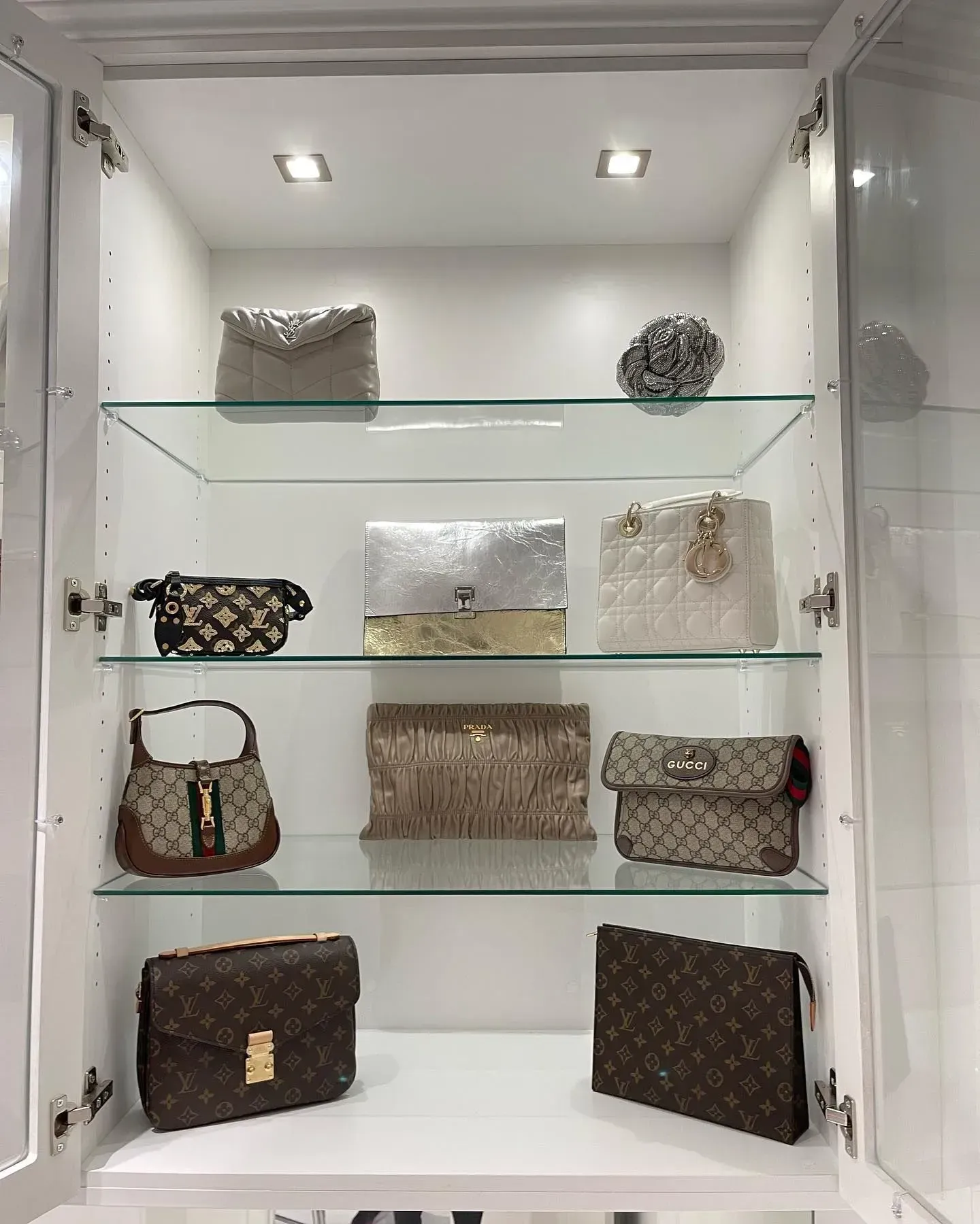A closet filled with lots of handbags on display.