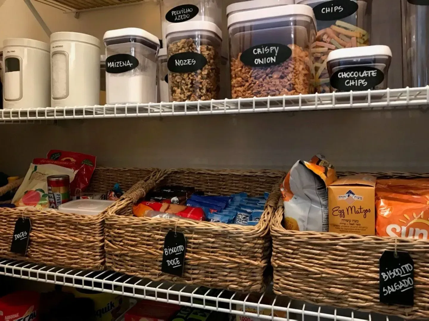 A pantry filled with lots of food and baskets.
