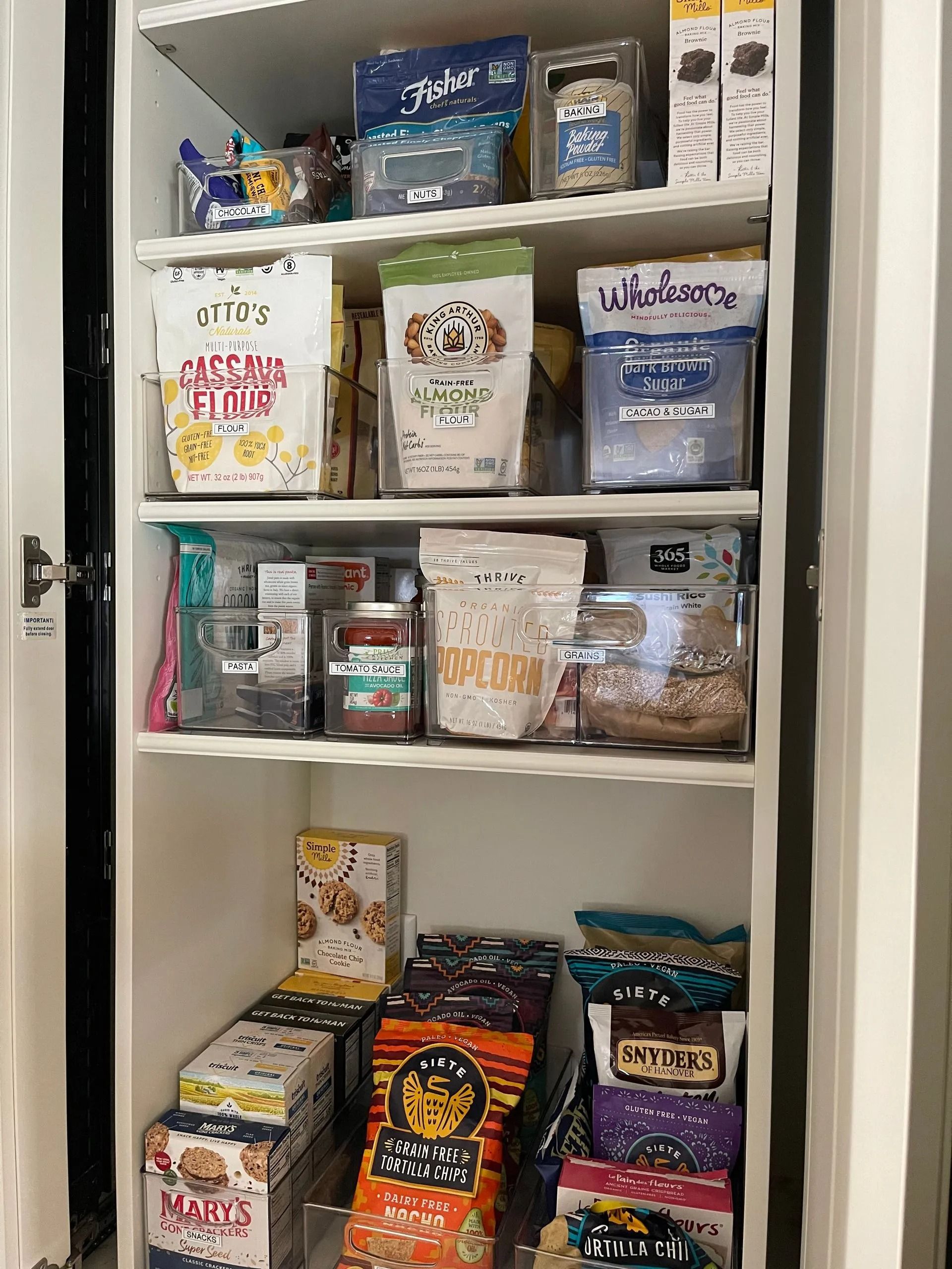 A pantry filled with lots of food and snacks.