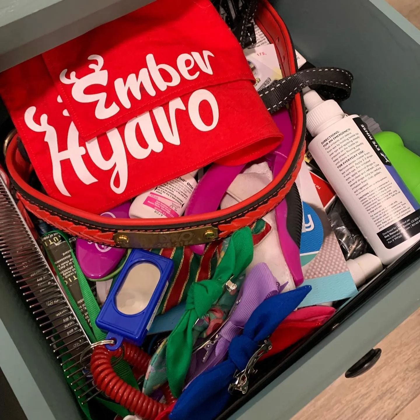 A drawer with a red shirt that says ember hyaro