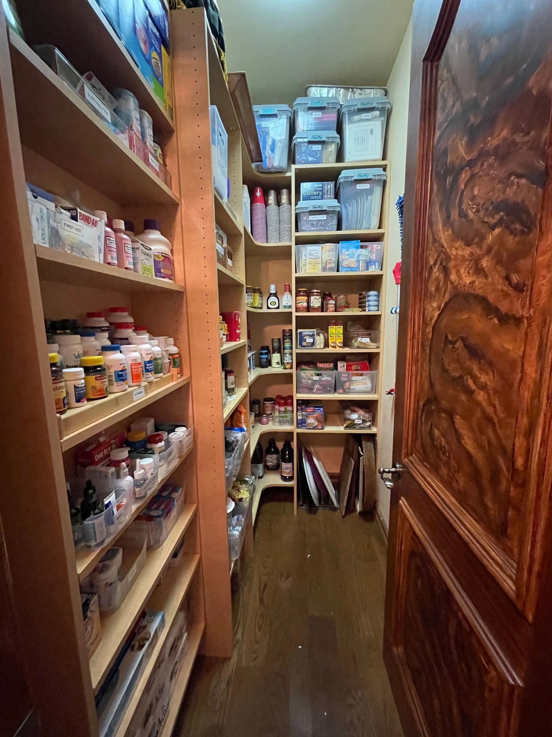 A pantry filled with lots of food and supplies.