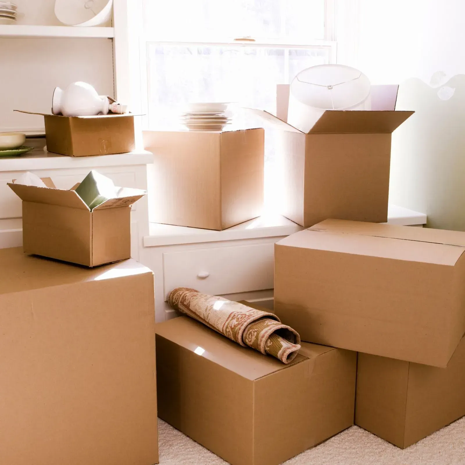 A bunch of cardboard boxes are stacked on top of each other